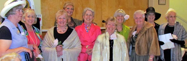 Volunteers presented a fashion show of clothing from the store and sang "Second Hand Rose".