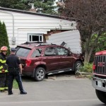 Van crashes through corner of home