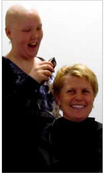 Sarah shaving Cst. Kim Guthrie's head at last April's Cops for Cancer Pedal for Hope event at the high school.