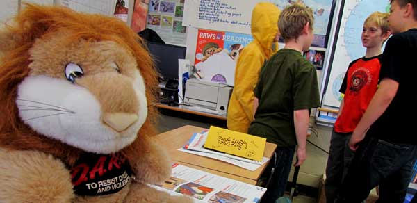 Mascot Daren the Lion keeps watch over the students as they work.