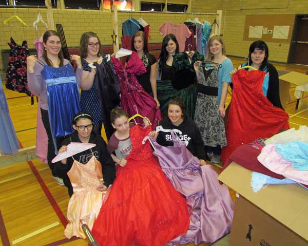 Students show off beautiful dresses donated by the community for this year's Prom Project at PECI.