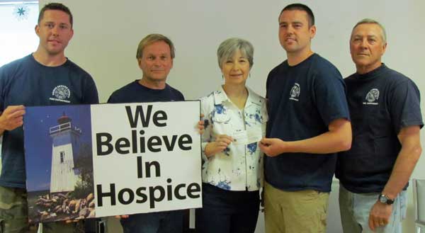 Hallowell Firefighters Association members Chris Armstrong, Capt. David Fox, Wes Manlow and Capt. Steve Vickers presented Joscelyn Matthewman, Hospice Prince Edward vice-president with $500 raised at the the firefighters' Maple in the County pancake breakfast.