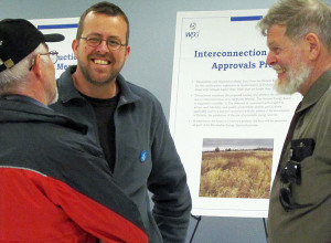 Jason Alford, community liaison representative, wpd Canada, chats with visitors at the open house