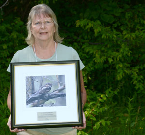Sheena Kennedy of the Prince Edward County Field Naturalists with the award. 