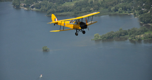 Flying high - In this file photo by Ross Lees, in 2013, a cadet experiences breaking the surly bonds of earth in a de Havilland Tiger Moth.