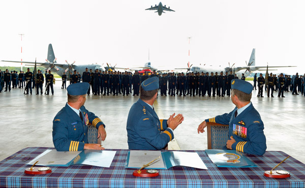 Maj.-Gen. Pierre St-Amand, Col. David Lowthian, and Col. Sean Friday observe the CC-177 Globemaster III flypast. MCpl Roy MacLellan photo