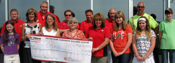 Pictured here presenting the cheque (back row, from left) Home Hardware owner, Adam Busscher, Home Hardware employees, Paul Courtney, Aaron Calvert, Darren Haennel, Dwayne Gibson and John Thissen and volunteer, Bryan Cronk (front row, from left) volunteer, Joan Marie Cronk, Anna Marie Ferguson, executive director of the PECMH Foundation, Fran Donaldson, vice president of the Foundation, Home Hardware owner, Chrissy Busscher and volunteers, Mira and Brooke Busscher. Briar Boyce photo