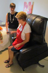 Heather Campbell and Peggy Payne demonstrated the sit-to-stand feature of the new recliners.