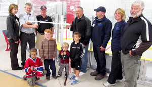 Krista and Tim Ward, Jim Dunlop, Dan Stasko, Richard Lightfoot, Merlin Dewing and Lisa Linsay officially open the new mini sticks arena at Wellington.