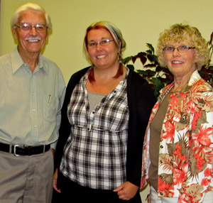 Choir member Mervyn Hicks and director Laura Demers presented Briar Boyce, (centre) communications co-ordinator with the PECMH Foundation with the funds raised.