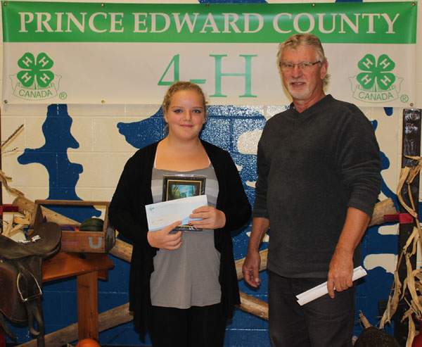 Representing the Bay of Quinte Mutual Insurance Company, long time sponsor of 4-H, Art Wiersma, presented the award for the top second year member to Cori Goodman. 