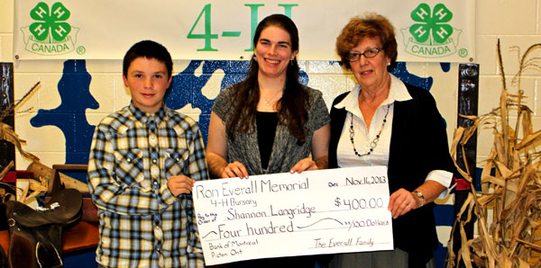 The Ron Everall Memorial Bursary provides $400 to a Prince Edward County 4-H member enrolled in a post secondary degree or diploma program in a Canadian educational institution.  This year, Mary Everall, Ron's wife and their grandson Joseph Burley, presented the bursary to Shannon Langridge who has completed a record 84 projects and is enrolled in first year at Kemptville College. 