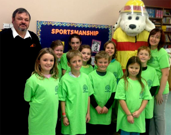 Grade 3, 4, 5 students at Sonrise Christian Academy show off their T-shirts with Sparky The Firedog and Fire Prevention Officer Mike Branscombe