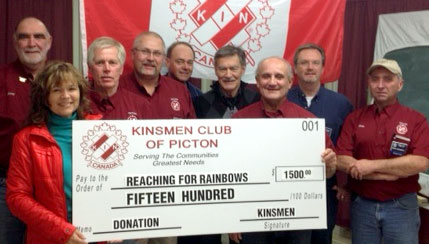 Attending the presentation of $1,500 to Reaching for Rainbows, from left, Reverend Lynne Donovan, Kinsmen Larry Craig, Ross Lindsay, President Phil St-Jean, Life Member Don Mowat, Paul Romanchuck, Rick Caruso, Brent Timm and Brian Lindensmith.