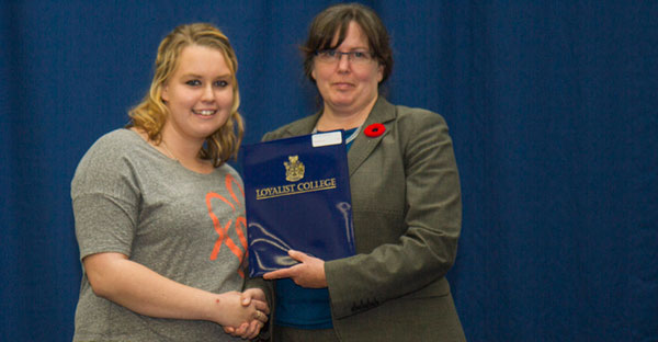 Brittany Nieman (left), first-year Social Service Worker student, was presented a Stark Family Fund Bursary by Tamara Kleinschmidt, Chair, Loyalist College Board of Governors.  Brittany is a PECI graduate. 