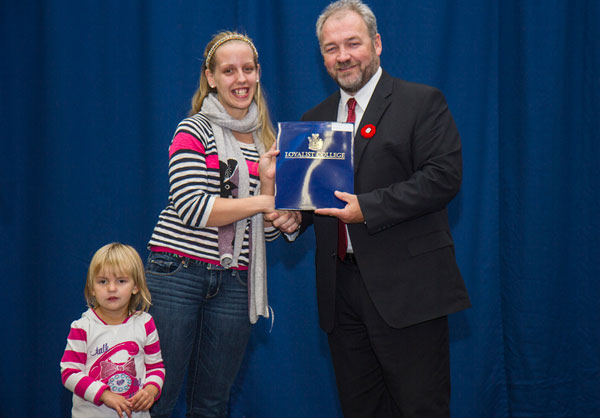 Jodie Wells (left), first-year Esthetics and Spa Management student, was presented a Loyalist College Dual Credit Bursary at the annual Loyalist College Undergraduate Awards. Presenting the bursary was Loyalist College Vice-President Academic, John McMahon. Jodie is a PECI graduate.  