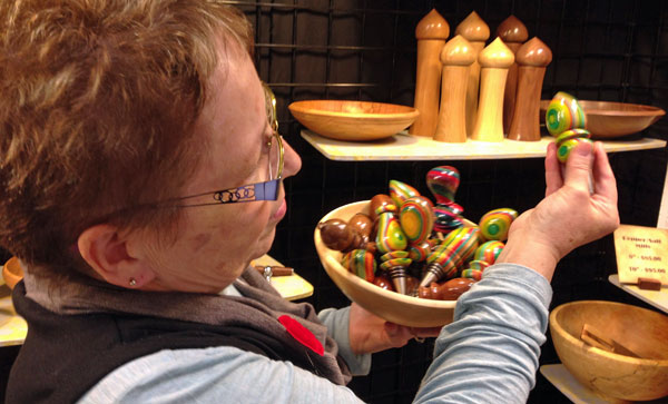 Lynne Ross, of Paul Ross WoodTurning, shows some colourful bottle stoppers.