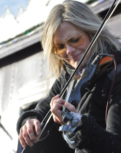 Melanie Doane sang and played the electric fiddle from the stage of the CP Holiday Train.-Photo by Ross Lees