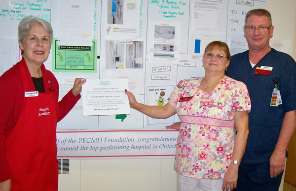 The PECMH Auxiliary, enormously proud of Picton hospital's staff, and all nurses and doctors for their achievement. Above, Carolynn Whiteley, Director of In-Hospital Services, presents a certificate of appreciation to Nancy Andrews, Team Leader, Inpatient Unit, and Rick Markland, Team Leader, Support Services.