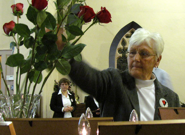 Picton councillor Bev Campbell places a rose.