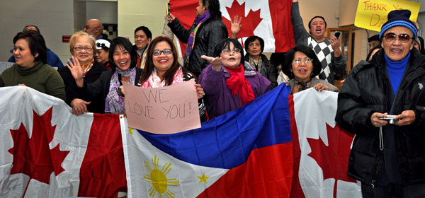 Members of the Canadian DART team were given an enthusiastic Philippino welcome home by members of the Toronto Philippino community Dec. 19 after their 40-day deployment to the storm-ravaged Philippine Islands. - Photo by Ross Lees