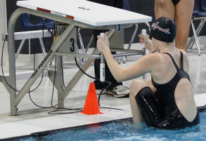 Morgan Clark on the starting block, ready for backstroke.