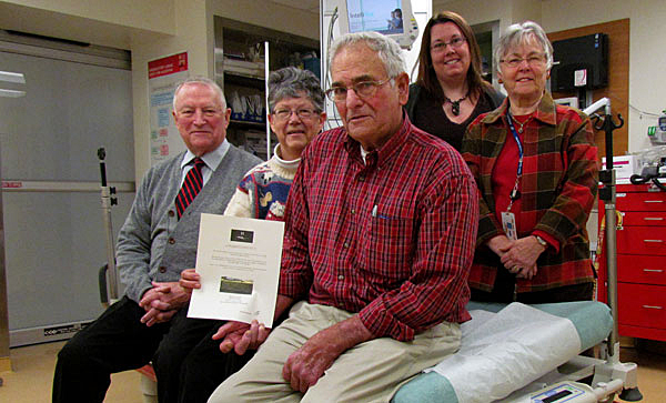 A recent patient at Picton hospital, Leo Finnegan (far left) was in a bed like this one needing use of cardiac monitoring equipment - precisly for what the Foundation is currently seeking public fundraising support. Sandra and George Emlaw, will exchange their seat on the hospital bed for a decadent one night stay at Huff Estates Winery Inn. Lanny and Catharine Huff donated a one night stay at the Inn with complimentary breakfast and a wine tour and tasting - valued at $250 - for the foundation to raffle off to a donor giving $100 or more to the appeal. With more than 200 donors qualifying for the draw, the Emlaw's ticket was drawn as the winner. At the presentation of the prize were Briar Boyce, communications co-ordinator, and the hospital auxiliary's Fran Donaldson.