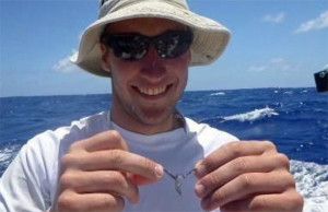 Sandy with a small flying fish.