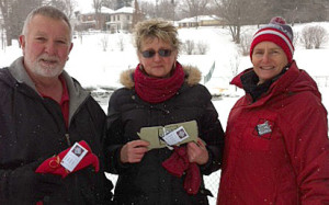 Vicky Sutherland, right, presented David and Alice Braidford with Picton Recreation 'Winter Active' scarves. 