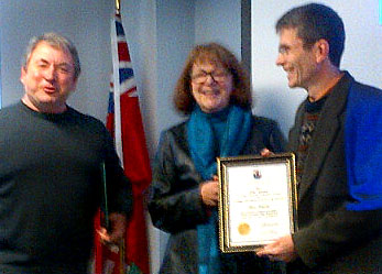 Terry Shortt and Janice Gibbons present the Heritage Award to Marc Seguin