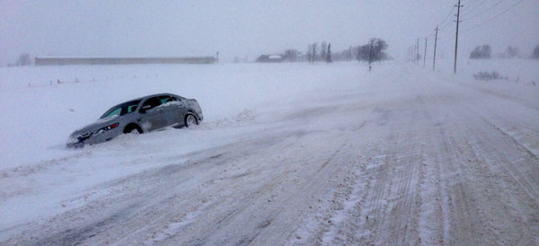 A car off the road at West Lake awaits assistance. Dale Miller photo
