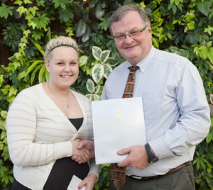 Brittany Nieman receives the Rotary Club of Picton Bursary from Allan Ross, Vice-President Corporate Services and Chief Financial Officer, Loyalist College, at the Spring Awards Ceremony.
