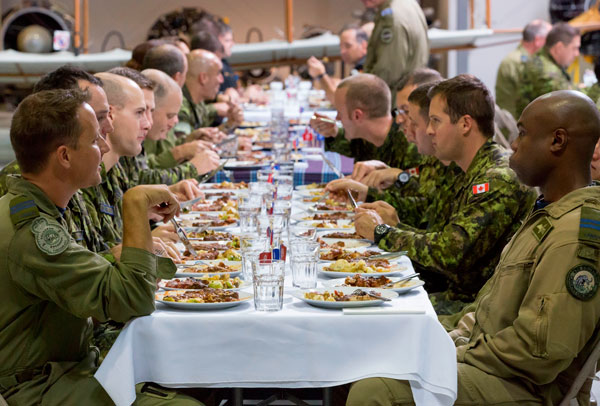 8 Wing members enjoy the delicious dinner served by MasterChef Canada. CTV photo
