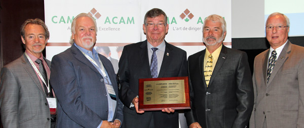 At the CAMA Awards of Excellence Ceremony in Niagara Falls, from left: Glen Davies, 2014 CAMA Awards of Excellence Chair and City Manager for the City of Regina, SK; Bruce Malcolm, President, Ravenhill Group Inc, Gold Level Awards Partner; Mayor Peter Mertens, County of Prince Edward; Merlin Dewing, Chief Administrative Officer, County of Prince Edward; Jean Savard, CAMA President, Director of Special Projects, Office of the CAO, Quebec City. CAMA National Office photo
