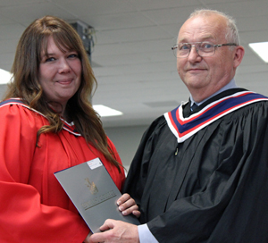 Kelly Forbes, Developmental Services Worker graduate from Carrying Place, was presented a Carolyn Orrick Award by Governor Tony Orrick.