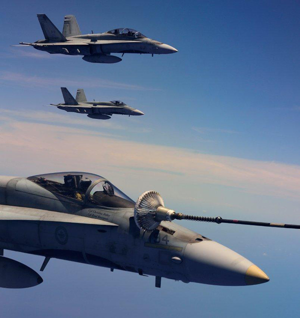 Three CF-18 Hornets come alongside a CC-150T Polaris to refuel just off the coast of Hawaii during the Rim of the Pacific (RIMPAC) Exercise 2014. Photo by Sgt Matthew McGregor, Canadian Forces Combat Camera