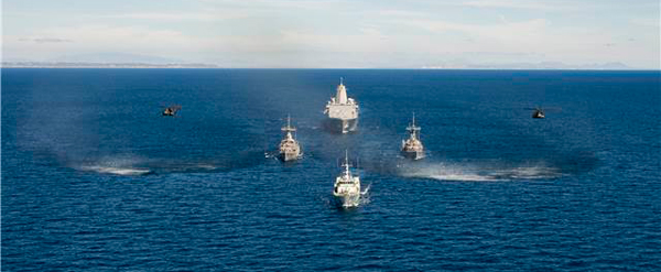 San Antonio-class amphibious transport dock ship USS Anchorage (LPD 23), Avenger-class mine countermeasures ships USS Scout (MCM 8) and USS Champion (MCM 4), and Canadian Forces Kingston-Class coastal defense vessel HMCS Nanaimo (MM 702 -front) transit in formation off the coast of Southern California as part of Rim of the Pacific (RIMPAC) Exercise 2014. U.S. Navy photo by Chief Mass Communication Specialist Mark C. Schultz