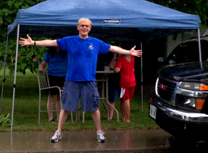 Bill McMahon, a race organizer, was delighted racers "kept the faith" during torrential rain for 20 minutes before the start time.