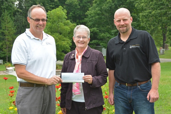 Dan Wight, Essroc Safety Manager presents cheque to Sandra Latchford, Chair of Glenwood Cemetery, and Jeremy Black, Essroc Plant Director.