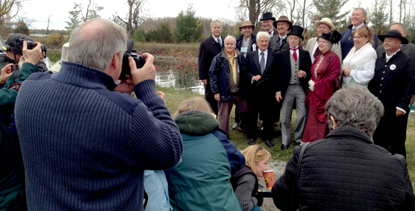 Event organizers and officials pose with Sir John and Lady Agnes at the 125th celebration of the Murray Canal