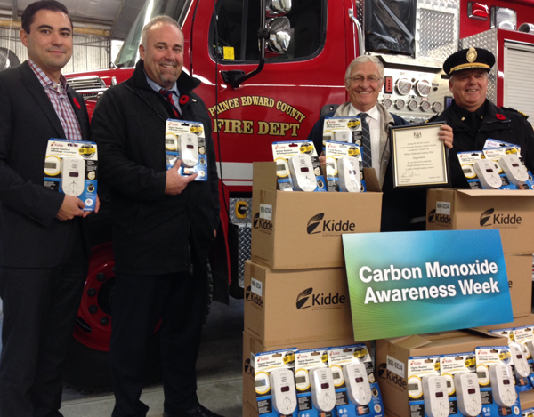 Prince Edward Hastings MPP Todd Smith and Oxford MPP Ernie Hardeman with Matt Hiraishi of the Insurance Bureau of Canada and PEC Fire Chief Scott Manlow at the presentation of carbon monoxide detectors.