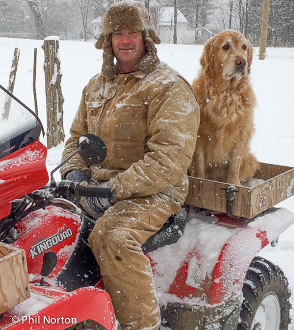 Greg Moore, with Barkley, arriving home after a day of cutting wood in the bush.