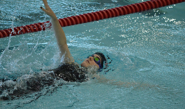 Faith Elsbury competes in backstroke