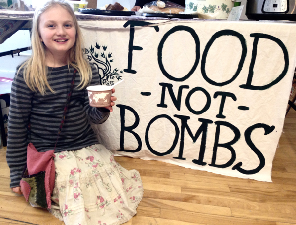 Maya Kaducstojsic, a Food Not Bombs helper at Seedy Saturday, served free cups of soup and desserts. 
