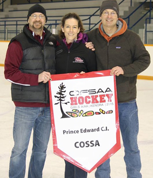 Coaches Adam Palmer, Laurie Spencer and Todd Morsette with the OFSAA banner.