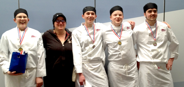 Lily Sullivan, of Waupoos Estates Winery, chef coach, celebrates with gold medal Iron Chefs Jared Hartley, Keith Petrasek, Andrew Petrasek and Josh Gibbons.