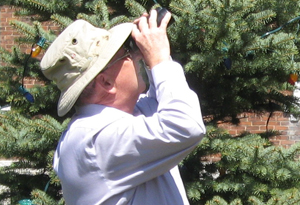 Mayor Robert Quaiff practices birding in Picton before his guest birder day at PEPtBO.