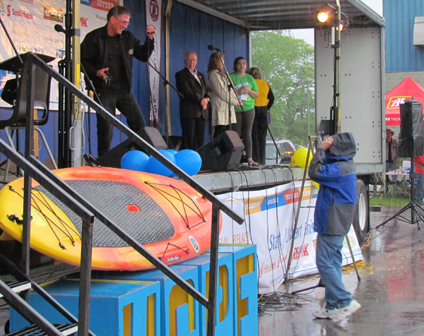 Paul Johnson and Rob Kellough, of Through the Cedars Music Productions, save the day with sound secured from the downpours.