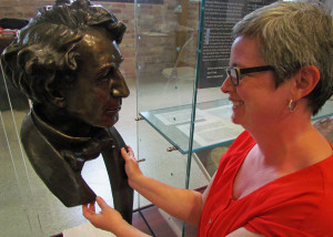 Curator Jennifer Lyons with the Sir John bust created by Ruth Abernathy.