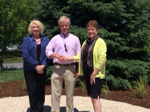 Hospice Prince Edward Foundation President Linda Middleton, right, welcomes Community Care Access Centre Board Chair David Vigar and new interim administrator Angela Jodoin, to the new Serenity Garden at Hospice.